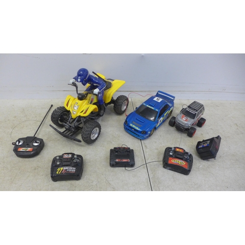 5056 - A collection of remote control cars including a Subaru Impreza, Land Rover and a quad bike and assor... 