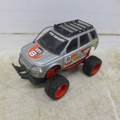 5056 - A collection of remote control cars including a Subaru Impreza, Land Rover and a quad bike and assor... 