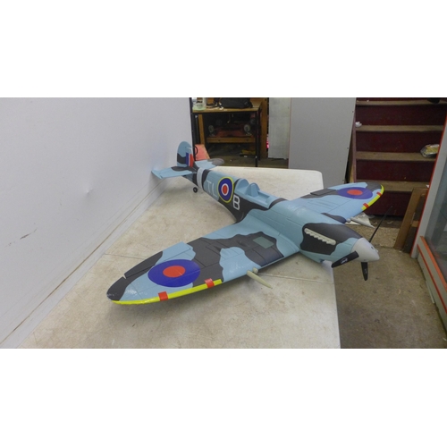 5066 - A motorized model RAF TL-B PL344 Spitfire airplane and a motorized model cub plane