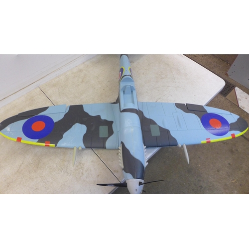 5066 - A motorized model RAF TL-B PL344 Spitfire airplane and a motorized model cub plane