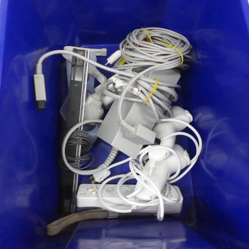 5070 - A Nintendo Wii and various accessories including a mega sports pack, a steering wheel, a copy of Wii... 