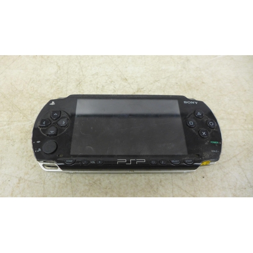 5071 - A Sony PSP handheld gaming console with charger and 14 games including Medal of Honor, Killzone, Gra... 