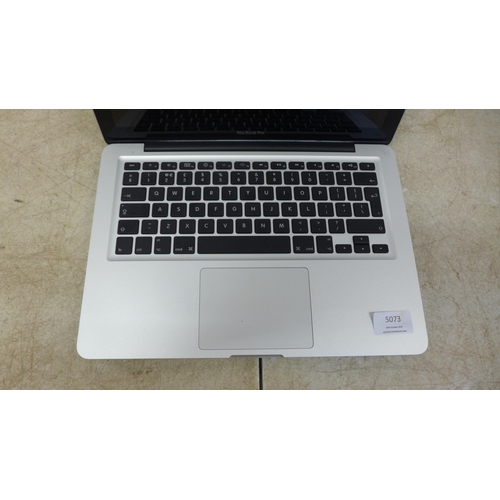 5073 - A MacBook 13 inch, LED backlit wide screen notebook with wireless Apple keyboard and a wireless Migh... 