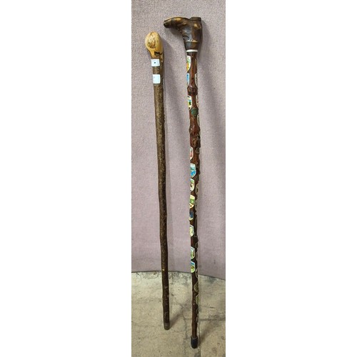 269 - Two walking sticks, bearing commemorative plaques, one handle in the form of a boot