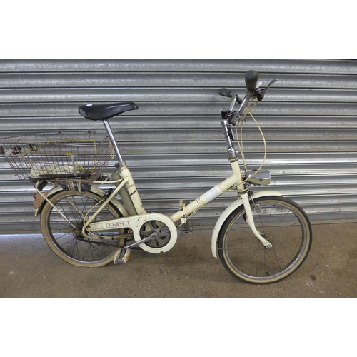 5134 - A vintage Raleigh Compact folding bike with panier rack, rear mounted basket and front headlamp