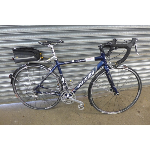 5136 - A Specialized Roubaix Road Racer bike with racing monologue carbon frame, pannier rack, travel bag a... 