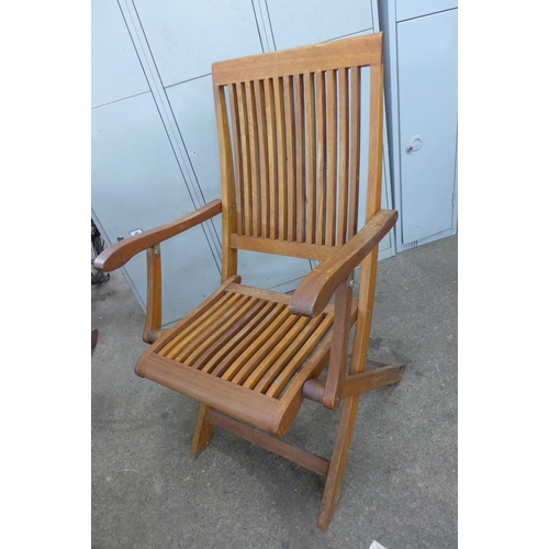 5154 - A Trifon teak Octagonal garden table and 4 folding chairs