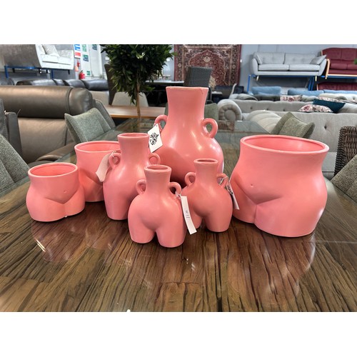 3011 - A set of six pink feminine vases