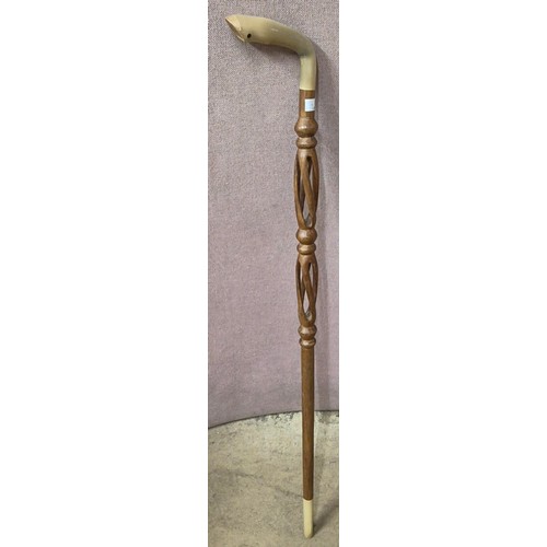 271 - An African carved hoof handled walking cane