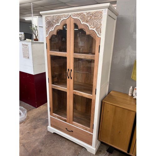 3079 - A tall white wood and glass cabinet *This lot is subject to VAT