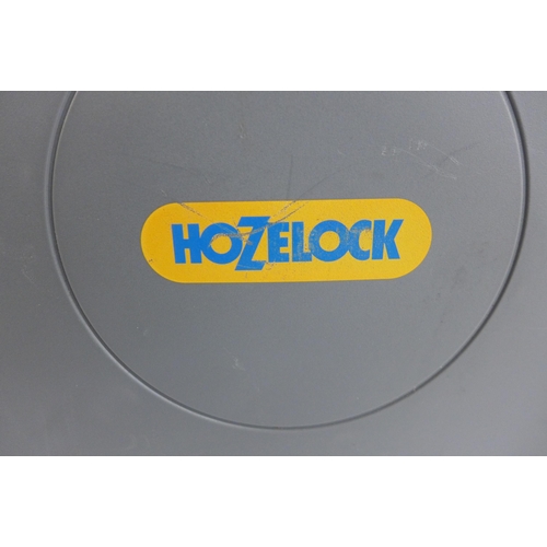 5170 - A large wall mountable Hozelock retractable hose reel