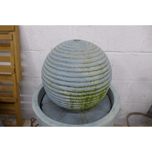 5173 - A water feature with ribbed sphere ornament - pump included