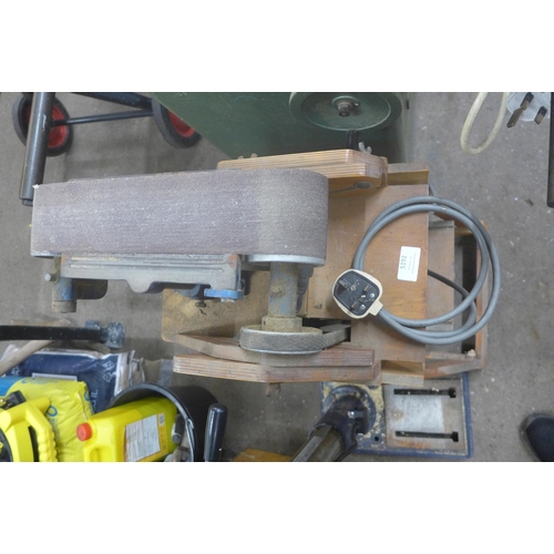 5192 - A Picador 240V belt sander mounted to a wooden framed work stand