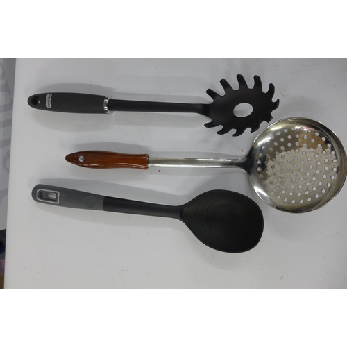 5228 - A quantity of kitchen items including a wooden knife block, slotted spoons, rolling pins, knives, a ... 