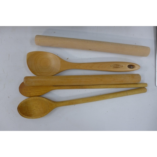 5228 - A quantity of kitchen items including a wooden knife block, slotted spoons, rolling pins, knives, a ... 