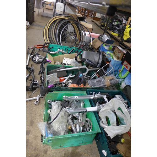 5238 - A large amount of vintage and current bike parts including wheels and tyres, forks, cranks, handle b... 