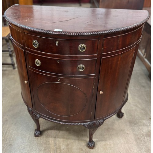 167 - A Regency style mahogany demi-lune side cabinet