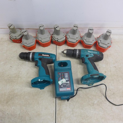 5006 - 2 Makita drills - an 8280D and an 8391D with a 14.4V battery charger and 7 assorted batteries