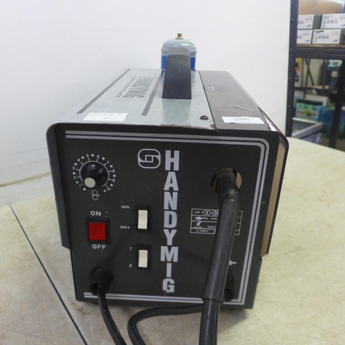 5005 - A HandyMig 230v, 80A welder with a welding mask and a quantity of consumables including a roll of we... 