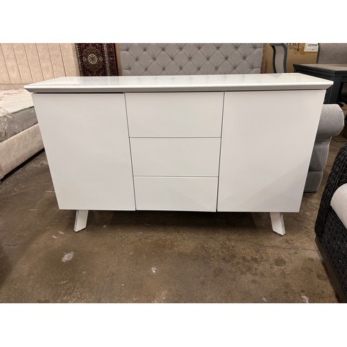 3109 - A white glass top side board with push to open doors and drawers