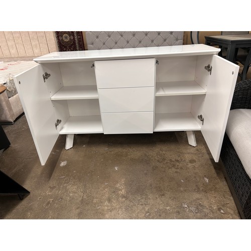 3109 - A white glass top side board with push to open doors and drawers