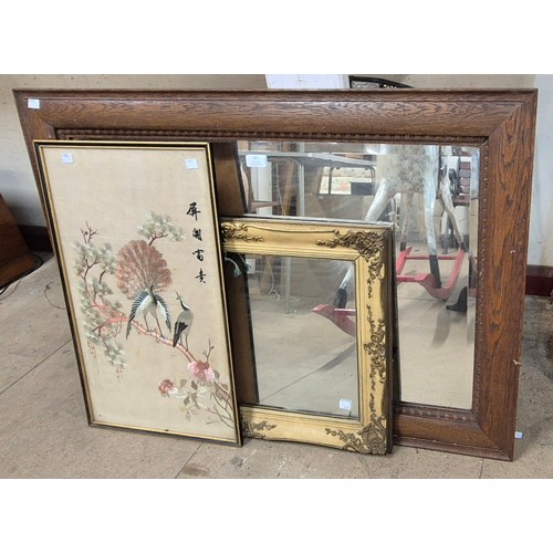 307 - A French style gilt framed mirror, an oak framed mirror and an Oriental silk embroidery