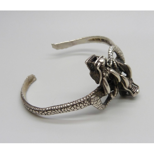 1002 - A 925 silver twin dragon detail bangle, 32.8g