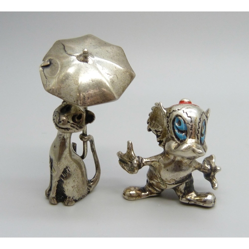 1008 - A small novelty .800 silver model mouse and a white model metal cat with umbrella, cat 51mm