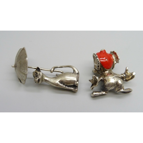 1008 - A small novelty .800 silver model mouse and a white model metal cat with umbrella, cat 51mm