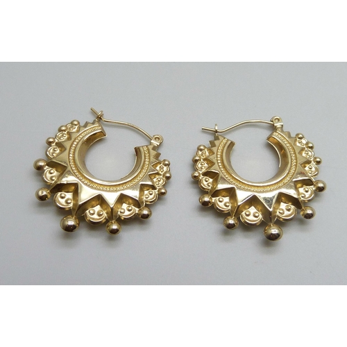 1012 - A pair of 9ct gold fancy hoop earrings, 2.4g