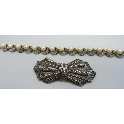 1023 - A silver and marcasite double clip brooch and a silver, marcasite and pearl bracelet, 46g