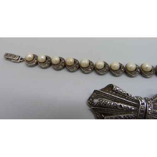 1023 - A silver and marcasite double clip brooch and a silver, marcasite and pearl bracelet, 46g