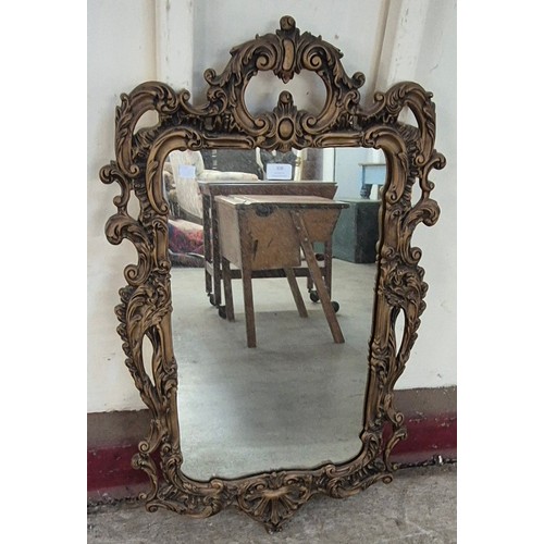 308 - A Rococo style gilt framed mirror