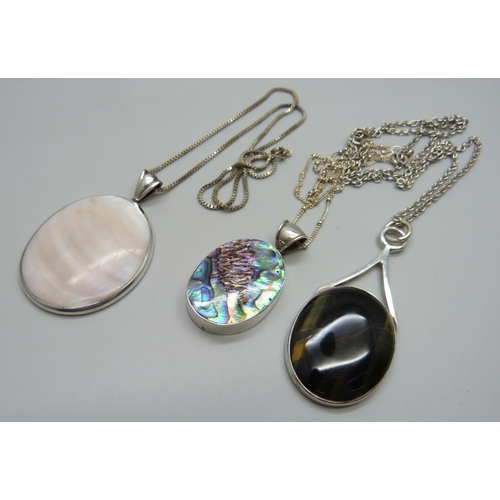 1025 - Three silver stone set pendants and chains