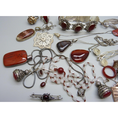 1034 - A collection of jewellery including red stone set and filigree