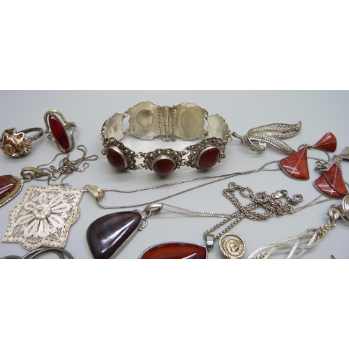 1034 - A collection of jewellery including red stone set and filigree