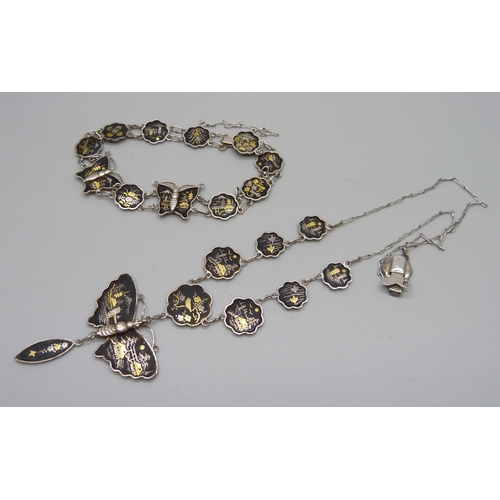 1036 - A Siam silver necklace and matching bracelet with  butterfly detail