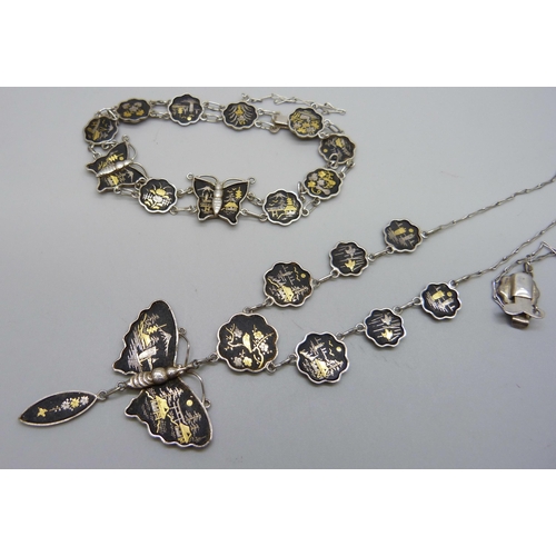 1036 - A Siam silver necklace and matching bracelet with  butterfly detail