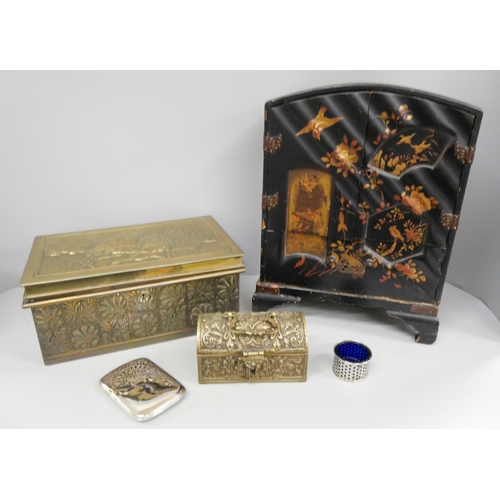 1055 - A brass box with bird detail, a brass casket marked 'Made in Belgium', a lacquered cabinet (requires... 