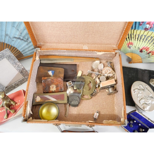 1058 - A case containing fans, spoons, brassware, etc. **PLEASE NOTE THIS LOT IS NOT ELIGIBLE FOR IN-HOUSE ... 