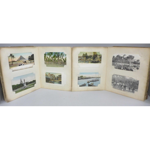 682 - An early 20th Century album of 52 Japanese postcards, lacquered boards