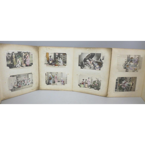 682 - An early 20th Century album of 52 Japanese postcards, lacquered boards