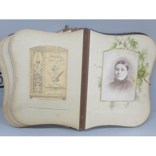 690 - An album of 19th Century cabinet cards and loose CDVs