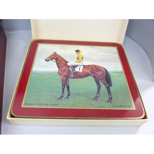 692 - A George Butler canteen of stainless steel cutlery and six horse racing place mats, boxed