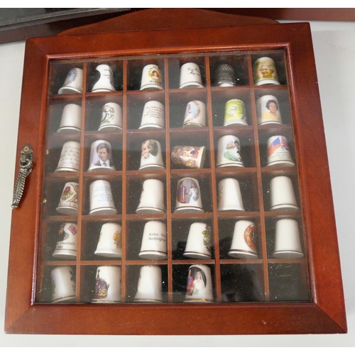 1077 - A large collection of thimbles displayed in three small cabinets with  a collection of bone china an... 