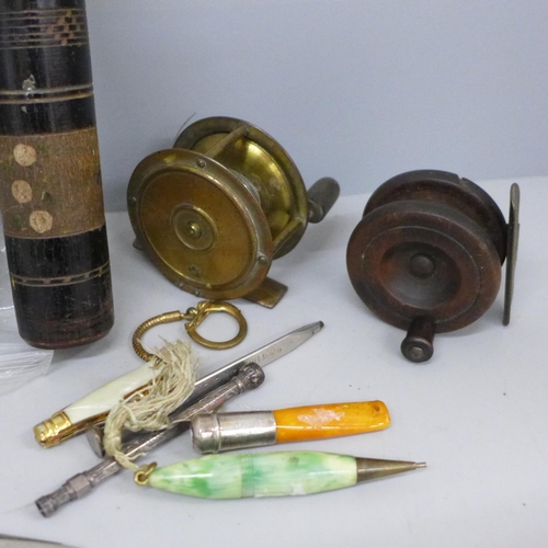 698 - Two miniature fishing reels, one wooden, one gilt brass, a bag of Britains metal figures, pill boxes... 