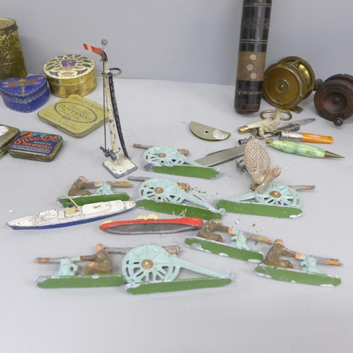 698 - Two miniature fishing reels, one wooden, one gilt brass, a bag of Britains metal figures, pill boxes... 