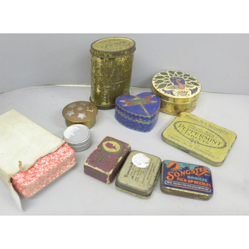 698 - Two miniature fishing reels, one wooden, one gilt brass, a bag of Britains metal figures, pill boxes... 