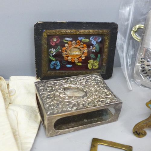 709 - A brass and enamel easel with devotional plaque, small framed Holy relic, 5 Franc coin brooch, a/f a... 