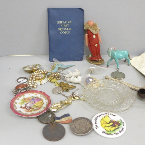 709 - A brass and enamel easel with devotional plaque, small framed Holy relic, 5 Franc coin brooch, a/f a... 